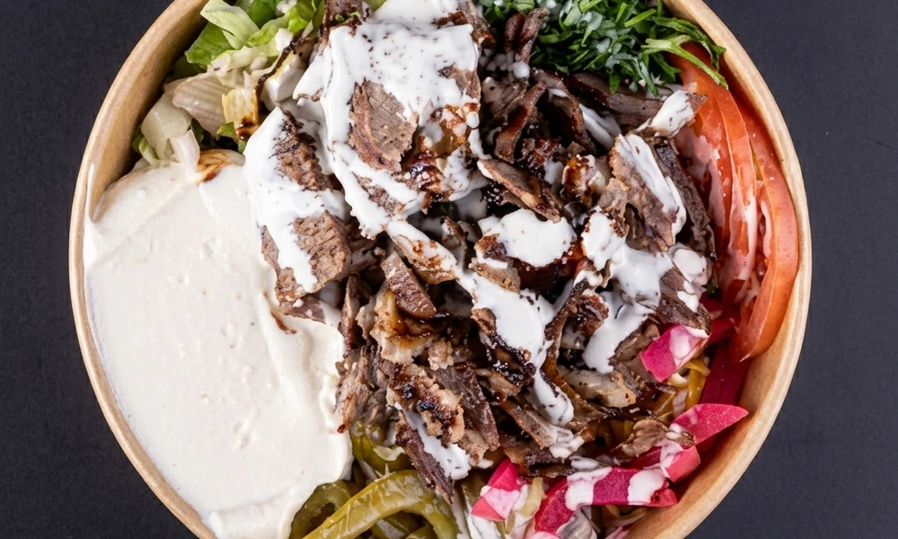 Beef shawarma bowl with rice, fries and garlic sauce at Al Zain London, Ontario