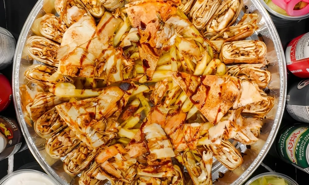 Combination platter with rice and sides served at Al Zain in London, Ontario